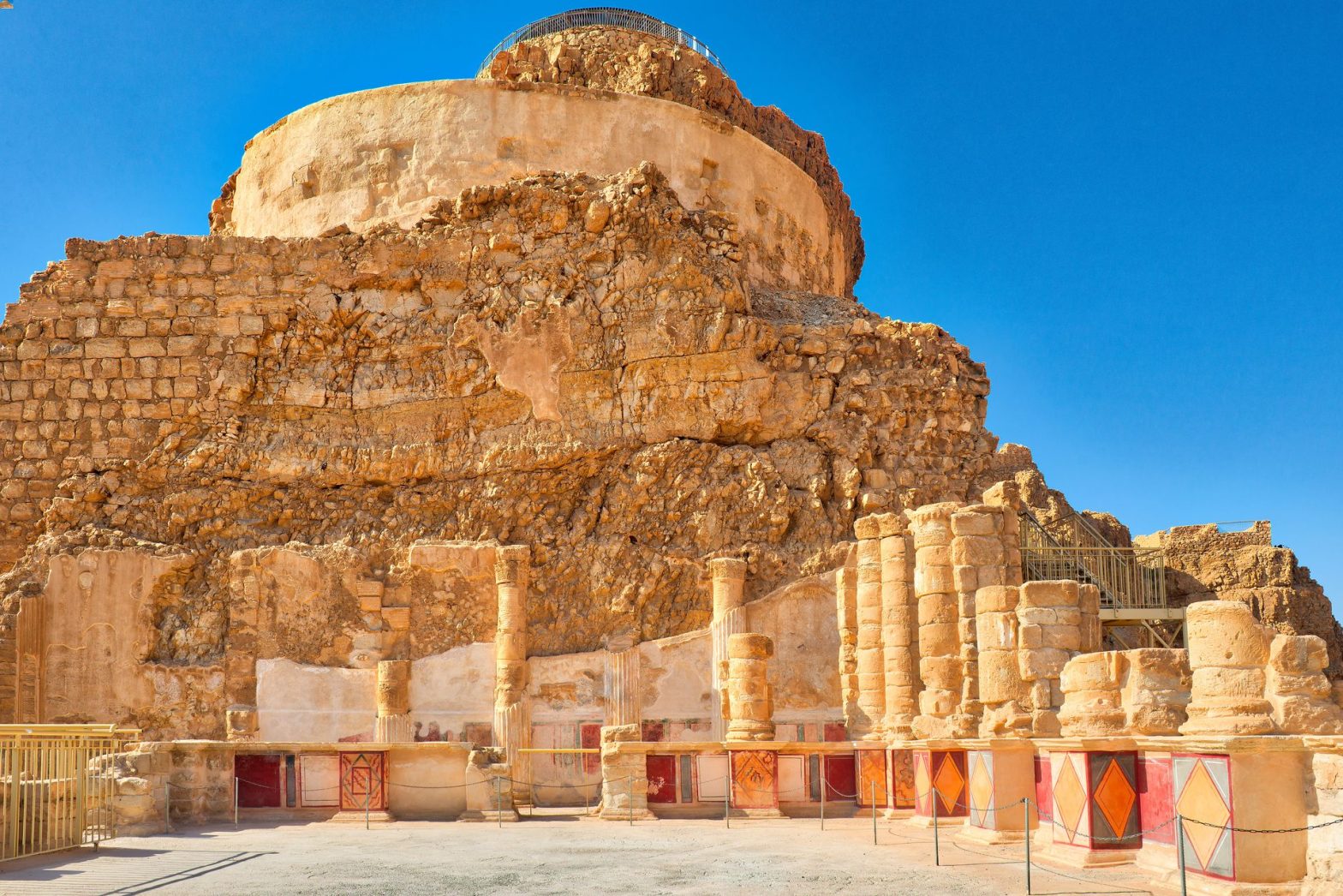 Fortress ruins rising on desert cliff
