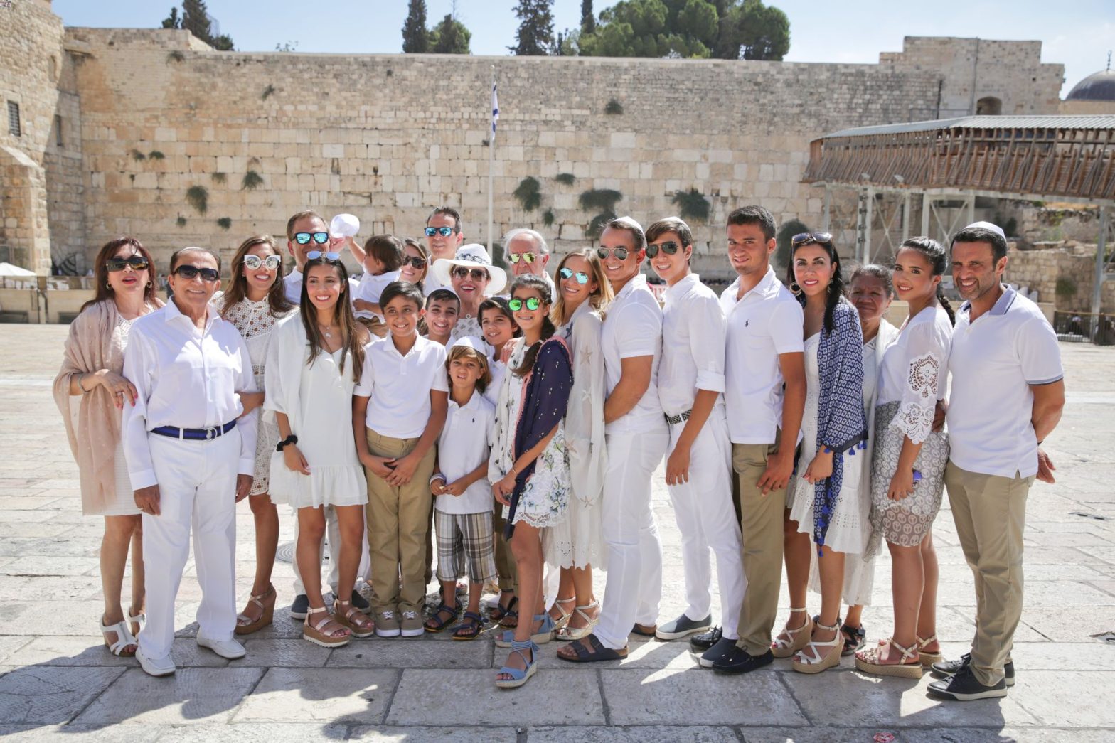 Multigenerational family posing at Western Wall