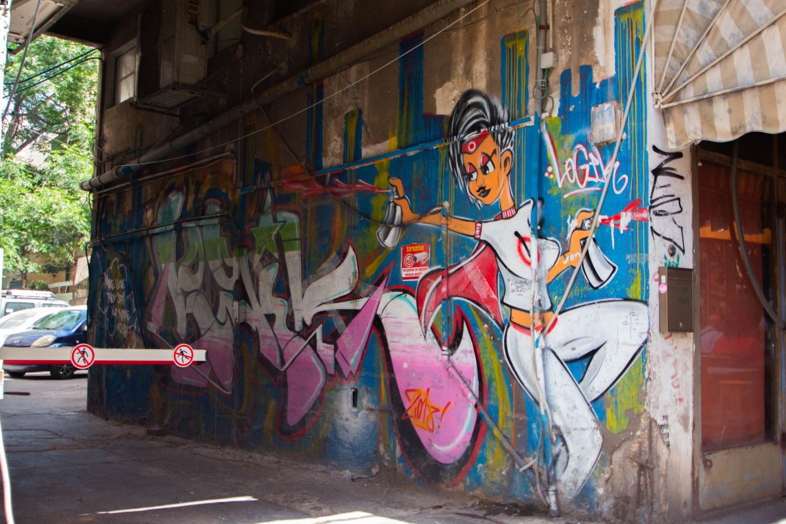 Cartoon woman spray-painting alley wall
