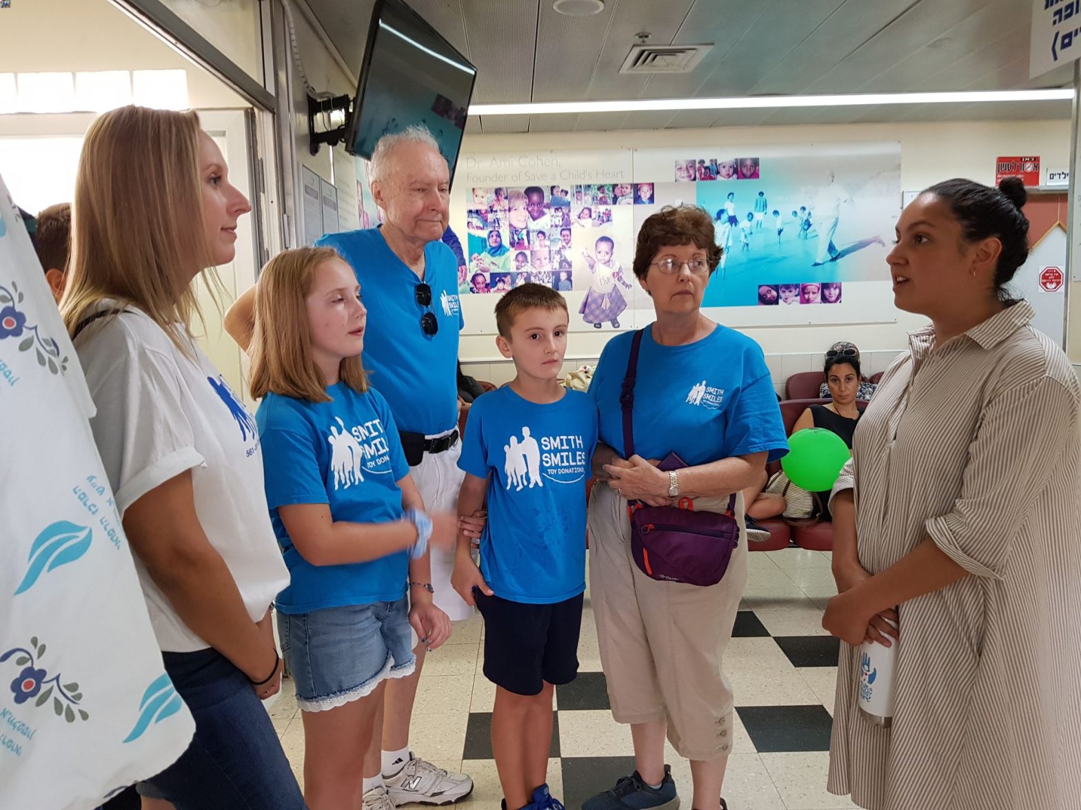 Volunteers talking in a hospital hallway